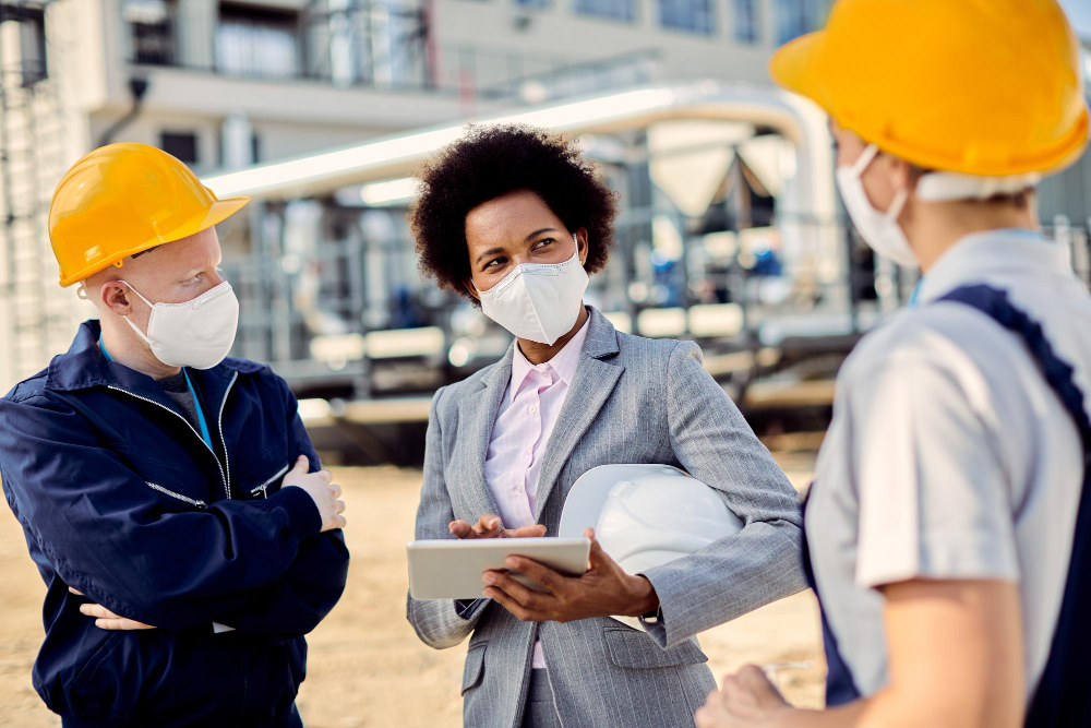 Group of contractors discussing a project at a construction site