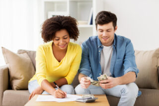 Family at home budgeting on table