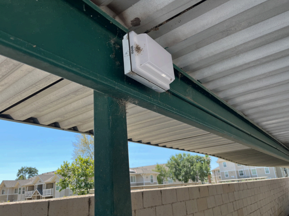 After picture of LED Light fixture in parking lot of Huron Plaza Apartments